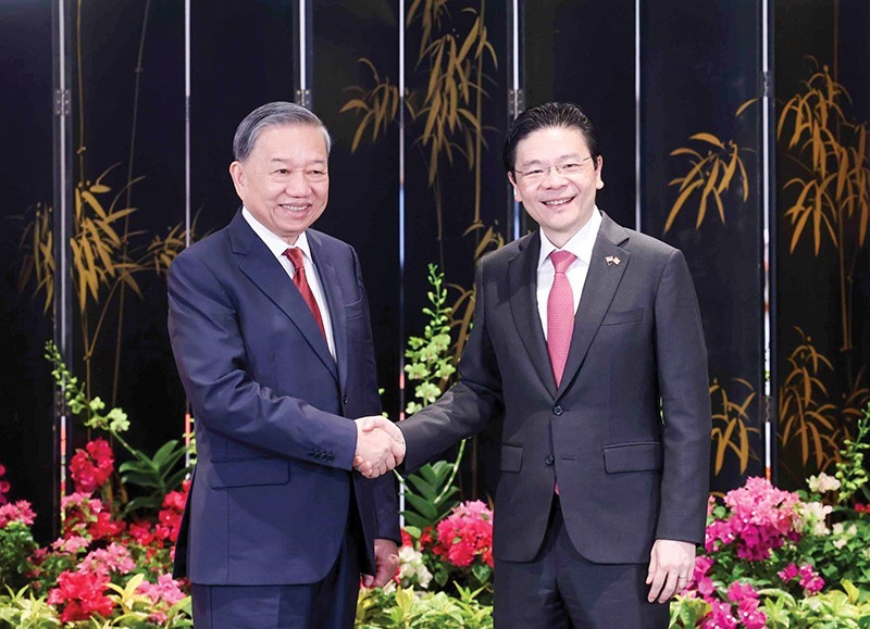 Tổng Bí thư Tô Lâm và Thủ tướng Singapore Lawrence Wong tại cuộc gặp gỡ và phát biểu với báo chí. Ảnh: Thống Nhất (TTXVN)