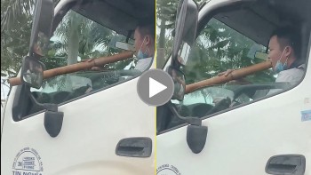 Tài xế xe cứu hộ giao thông vừa lái xe vừa hút thuốc lào trên QL18