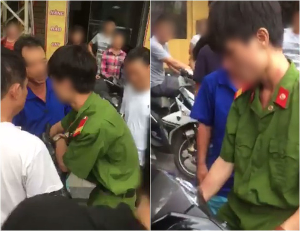 nam thanh nien mac quan phuc bi nguoi dan vay danh giua pho la cong an nghi a vu